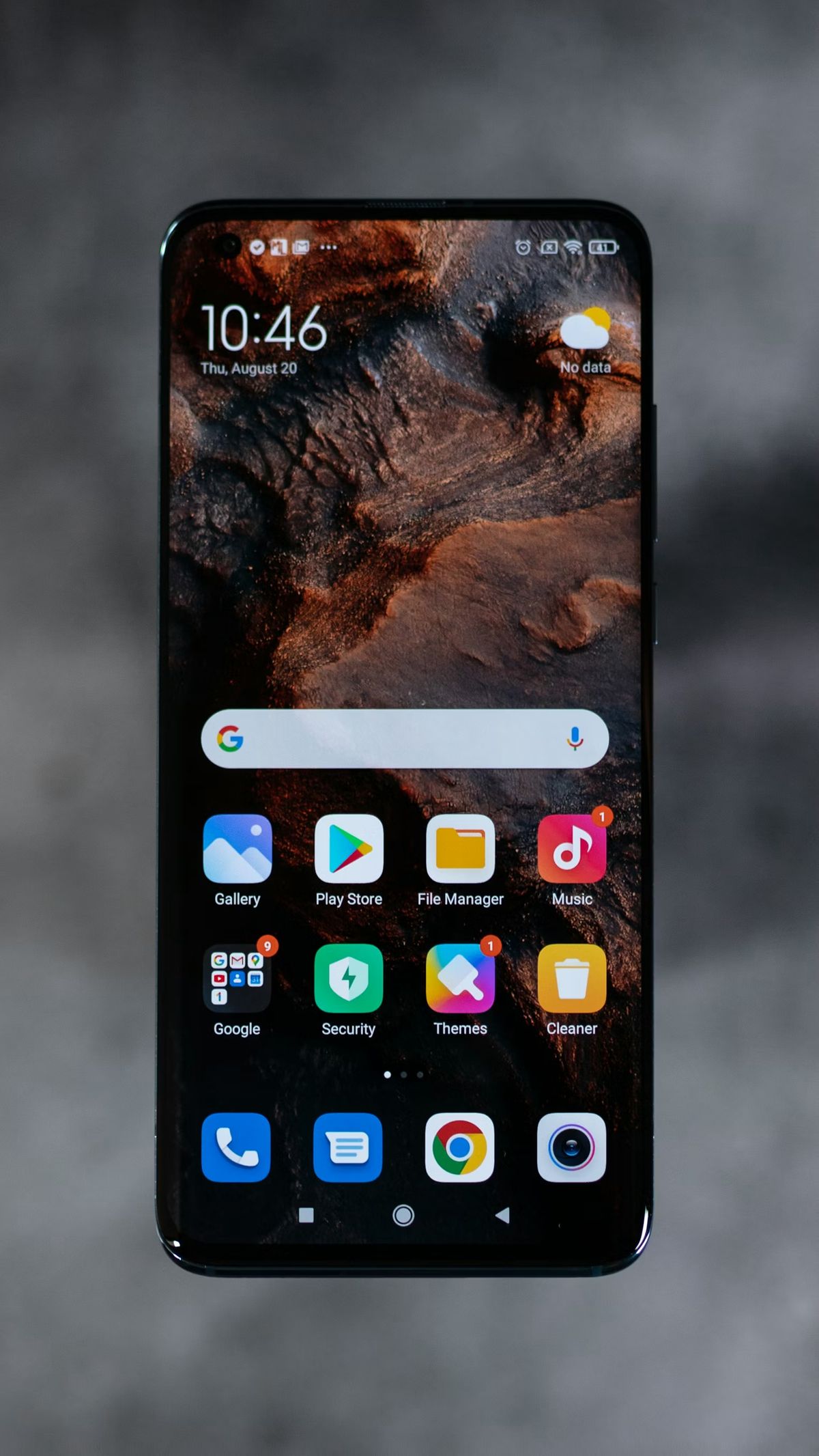 An Android phone home screen with a Mars wallpaper